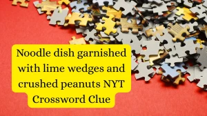 Noodle dish garnished with lime wedges and crushed peanuts NYT Crossword Clue